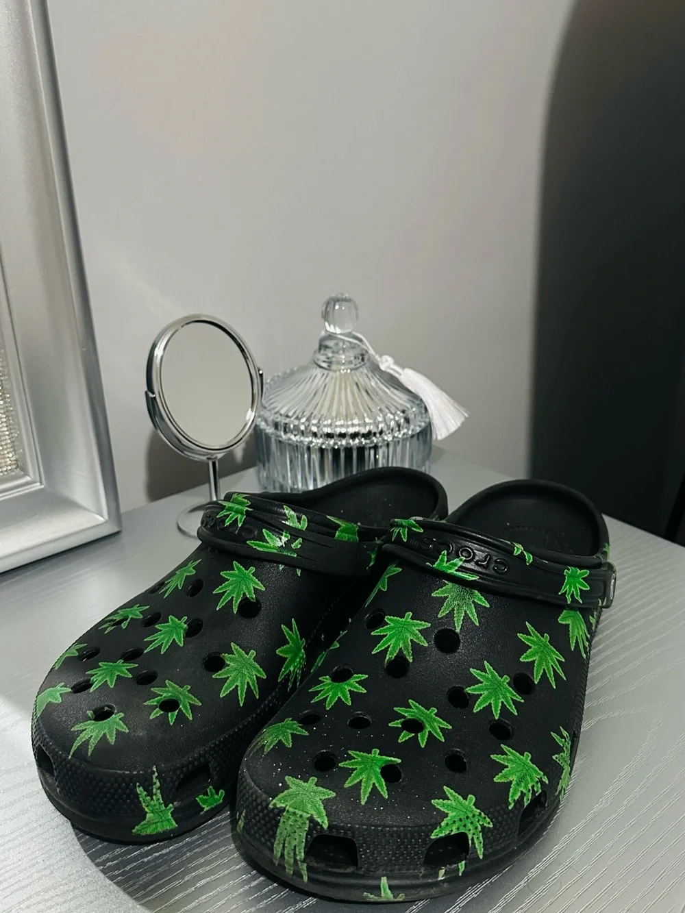 CROCS Black Slip-On Clogs with Green Leaf Print